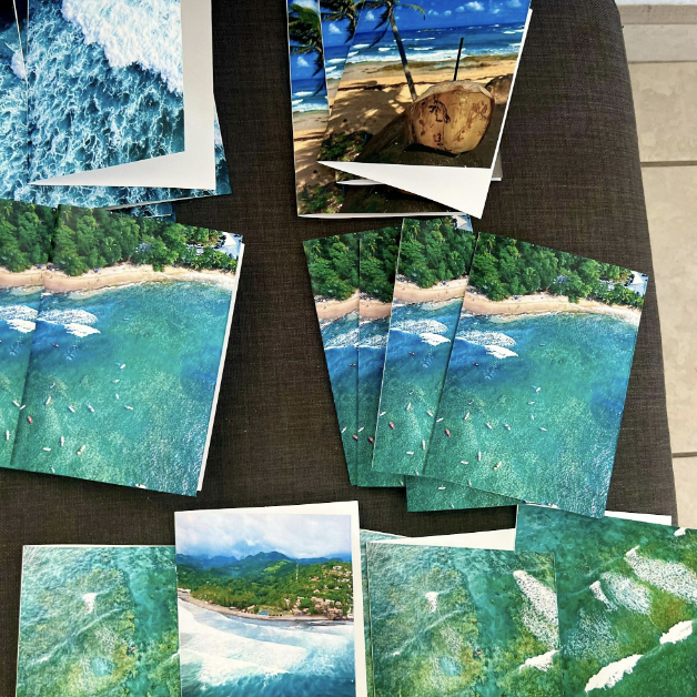 Multiple prints of Rincon, Puerto Rico laid out on a table